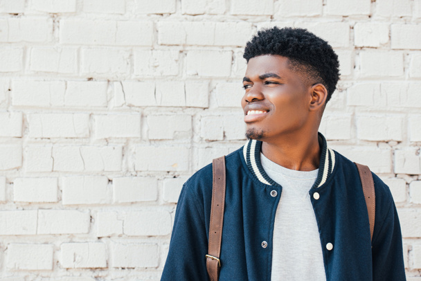 portrait of young african american man in trendy blue bomber  - Photo, Image
