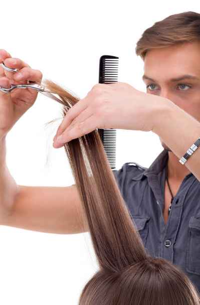 Parrucchiere professionale con modello di capelli lunghi, isolato su sfondo bianco
 - Foto, immagini