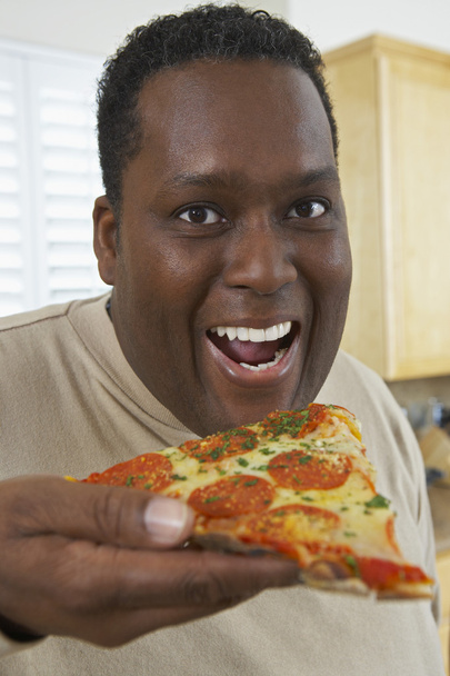 Man Eating Slice Of Pizza - Fotografie, Obrázek