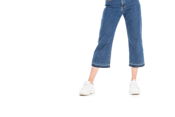 cropped view of woman in trendy jeans isolated on white - 写真・画像