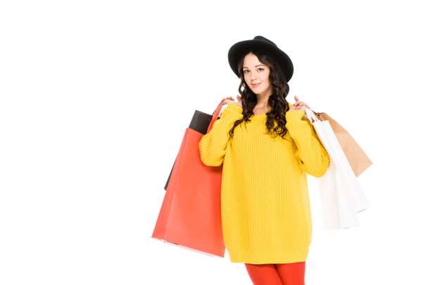attractive girl holding shopping bags, isolated on white - Фото, зображення
