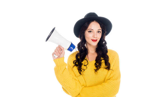 attractive fashionable girl in hat holding megaphone isolated on white - Zdjęcie, obraz