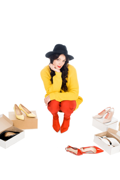 stylish shopaholic with footwear boxes isolated on white  - 写真・画像