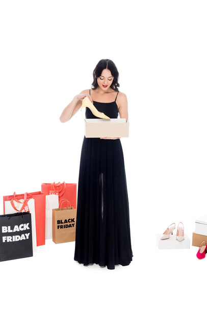 attractive woman holding footwear box isolated on white, shopping and black friday concept - Фото, зображення
