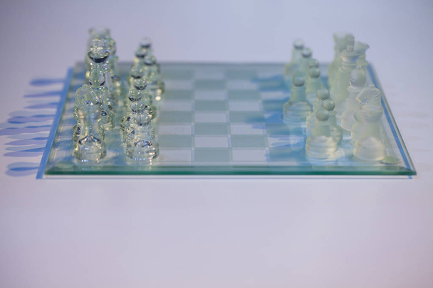 glass chess on the transparent chessboard - Photo, Image