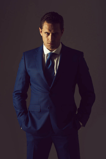 man with serious face and stylish hair in suit - Foto, afbeelding