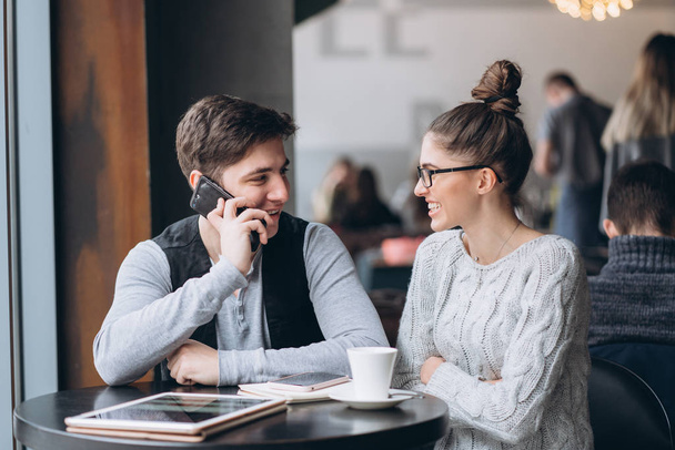 Guy and girl at a meeting in a cafe - Photo, Image