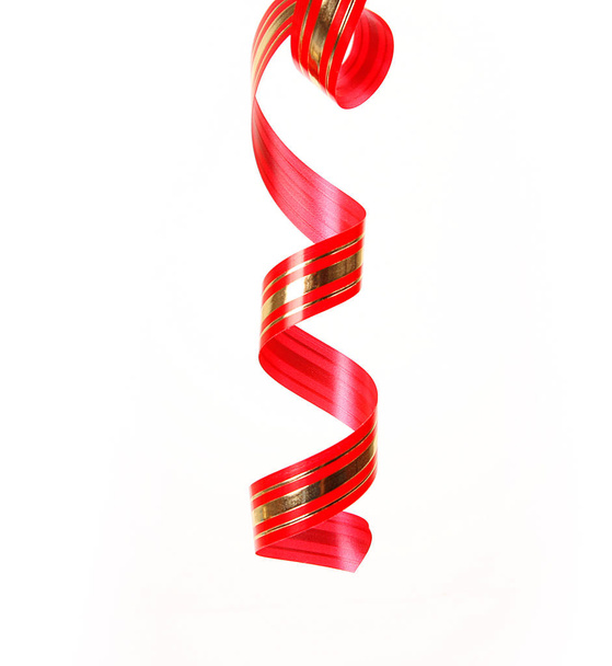 red serpentine ribbon on white background - Foto, Imagem