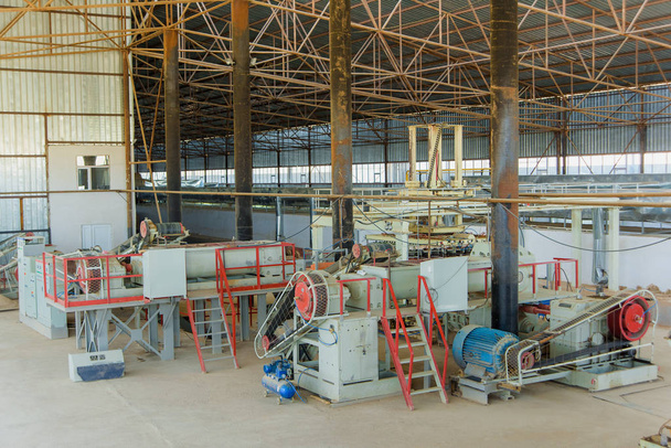 Brick making machine. Production of brick blocks in the factory. Preparing bricks. Plant for the production of building materials - Photo, Image