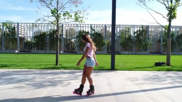 Woman on the rollers. Beautiful girl rollerblading. - Footage, Video