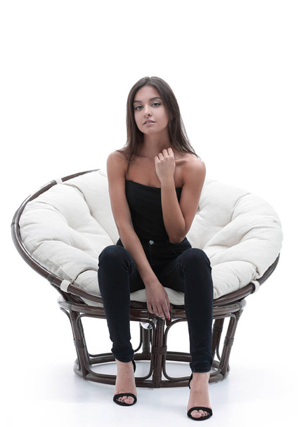 young woman sitting in a comfortable big armchair - Foto, immagini