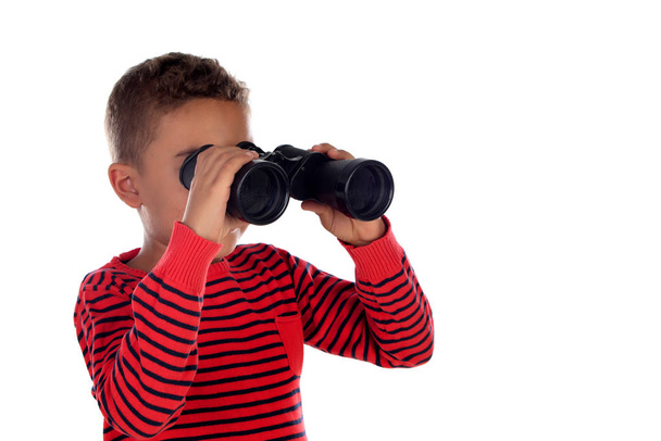 Latin child looking through binoculars isolated on a white background - Фото, зображення