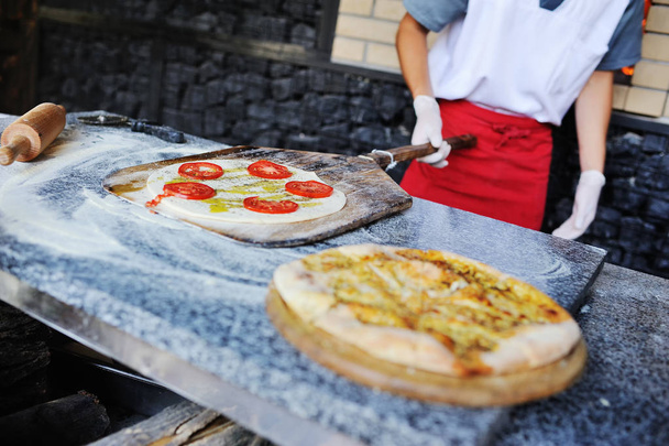 focaccia or Italian bread in the oven - Фото, зображення