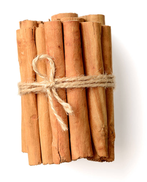 close up of cinnamon sticks isolated on white background - Fotó, kép