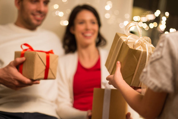 close up of family with christmas gifts at home - Φωτογραφία, εικόνα