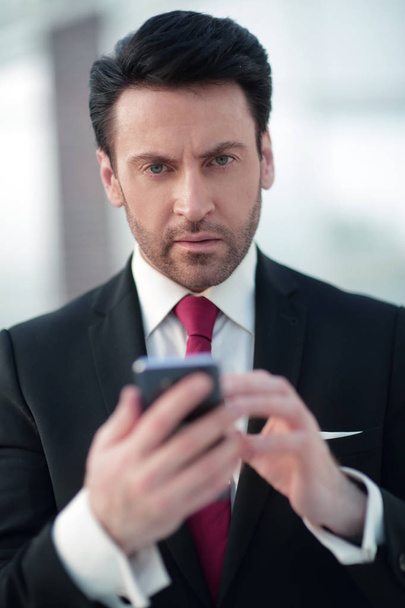 close up.businessman is typing SMS - Фото, изображение