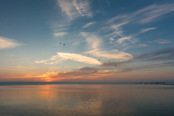Panoramic view of beautiful sunset over lake - Fotografie, Obrázek