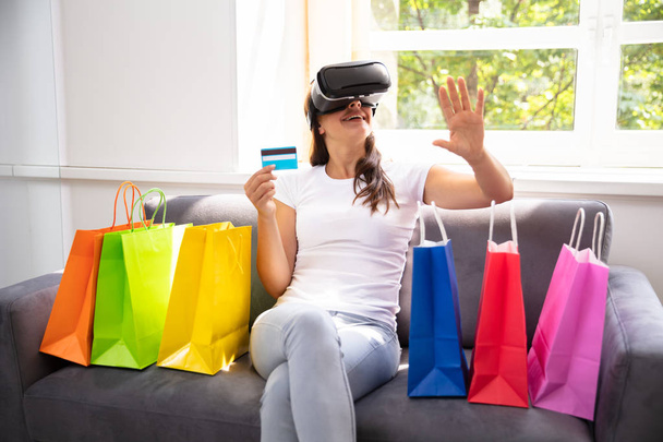 Happy Woman With Credit Card Doing Shopping With Virtual Reality Glasses - Zdjęcie, obraz