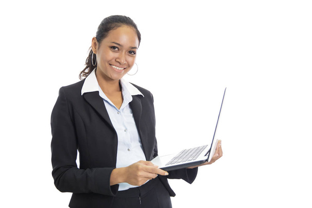 young business woman working on her laptop while standing - Photo, Image