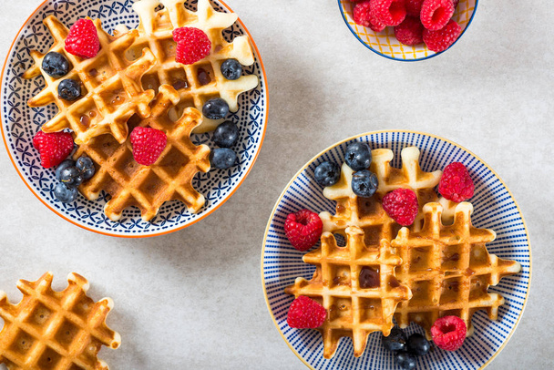 Traditional homemade belgian waffles with fresh berries and syru - Photo, Image
