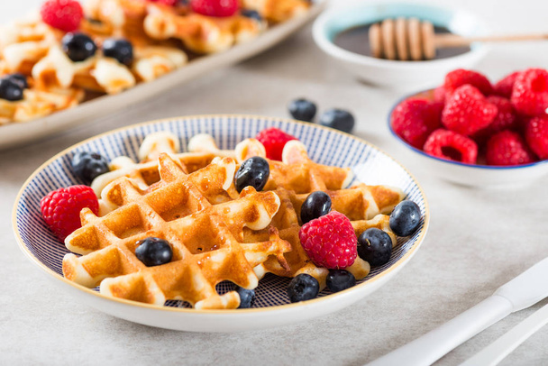 Traditional homemade belgian waffles with fresh berries and syru - Photo, Image