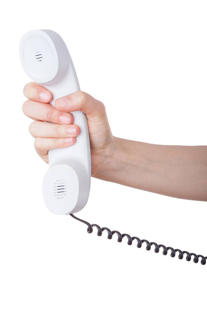Mão segurando um telefone isolado sobre um fundo branco
 - Foto, Imagem