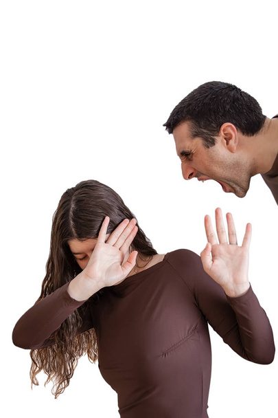 Domestic violence scene with a abusing husband or boyfriend shouting and yelling at his wife or girlfriend - Photo, Image