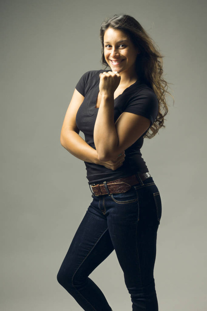 young beautiful woman posing in studio wearing casual clothes  - Foto, imagen