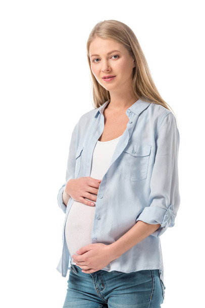hermosa mujer embarazada en ropa casual mirando la cámara aislada en blanco
 - Foto, imagen