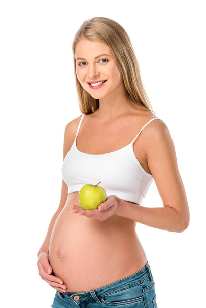 bela mulher grávida segurando maçã verde saudável isolado no branco
 - Foto, Imagem