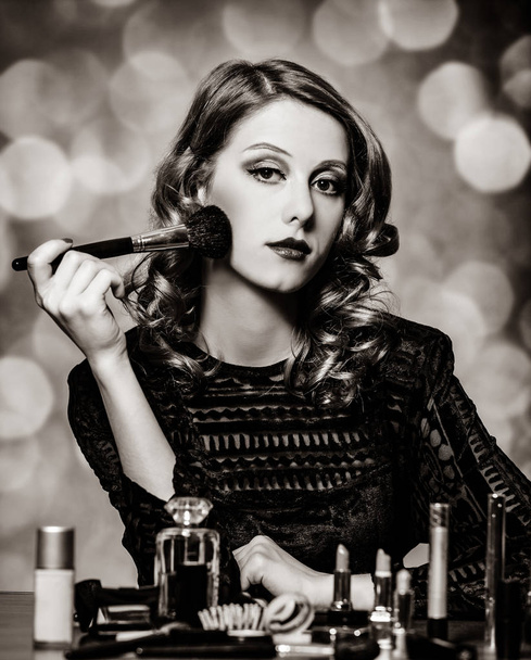Woman applying cosmetics - Photo, Image