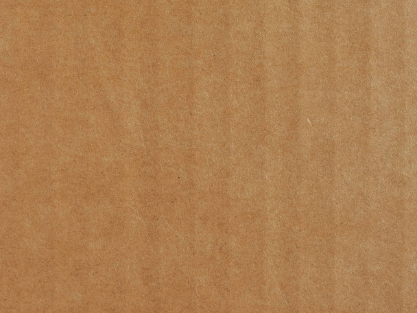 brown corrugated cardboard surface useful as a background, soft pastel colour - Photo, Image