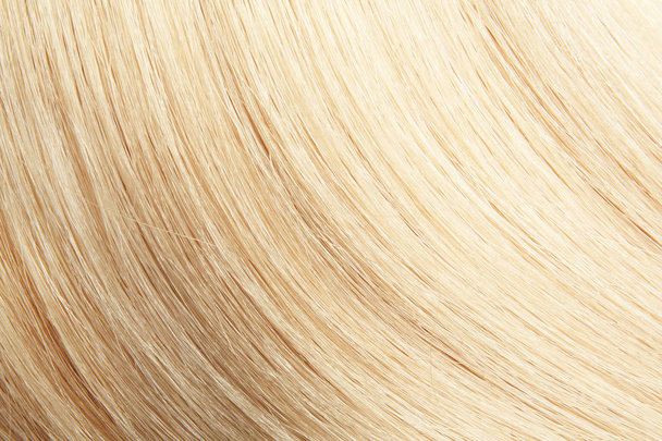 Texture of healthy blond hair as background, closeup - 写真・画像