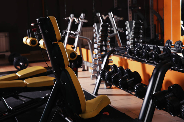 Gym interior with set of new equipment - Фото, изображение