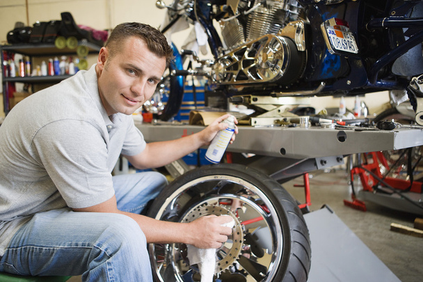 Mechanic Working On A Tire - Фото, изображение