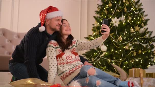 Portrait of Happy Couple. They Are Doing Selfie and Smiling Together. Happy New Year and Merry Christmas Concept. - Video