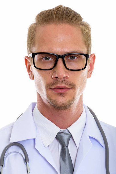 Face of young handsome man doctor wearing eyeglasses - Foto, Imagem