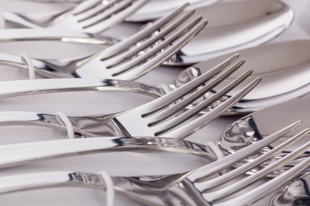 Close up macro detail of a flatware box set with forks and spoons. - Photo, Image