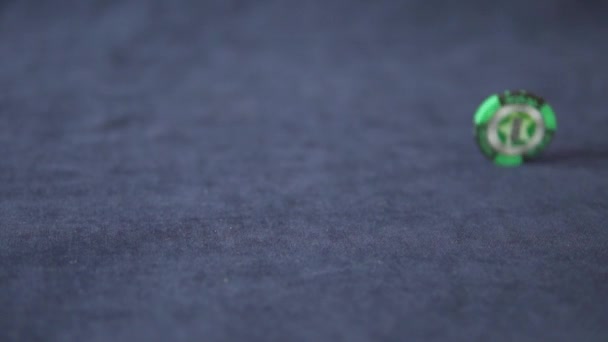 Green poker chip spinning slowly - 映像、動画