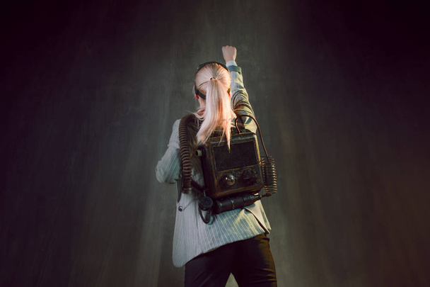 Young woman businesswoman with jetpack on the back. Business acceleration concept, startup, technology and development - 写真・画像