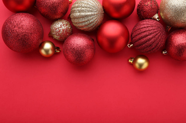 Red and gold christmas balls on a red background - Photo, Image