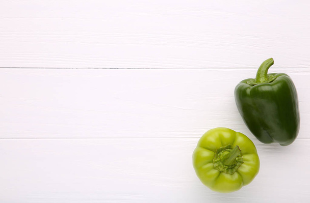 Green sweet pepper on table, paprika on white background - Zdjęcie, obraz