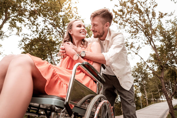 Disabled girl feeling happy while being with beloved man - Foto, immagini