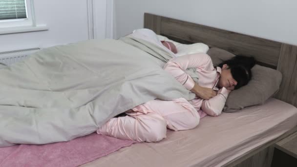 Woman trying to get herself blanket - Footage, Video