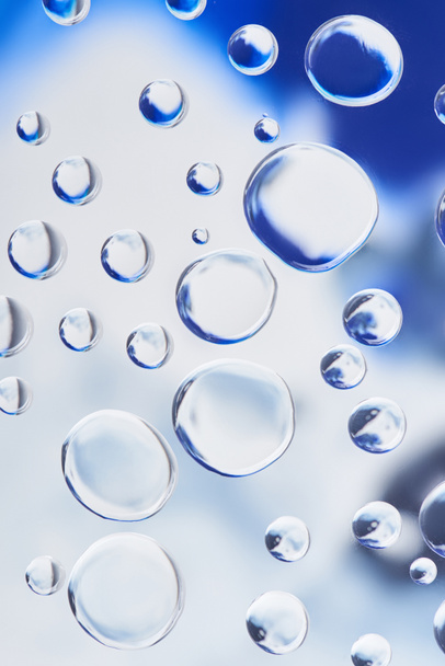 beautiful transparent water drops on blurred abstract background - Photo, Image