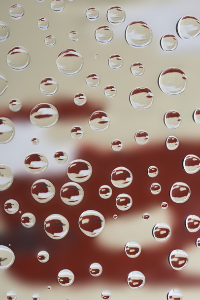 close-up view of beautiful transparent drops on blurred abstract background - Foto, Imagem