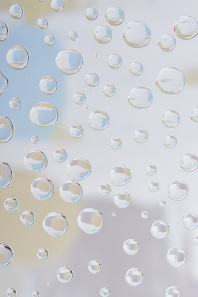 beautiful transparent drops on blurred abstract background  - Photo, image