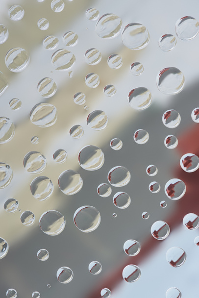 close-up view of transparent dew drops on blurred abstract background - Foto, Imagem