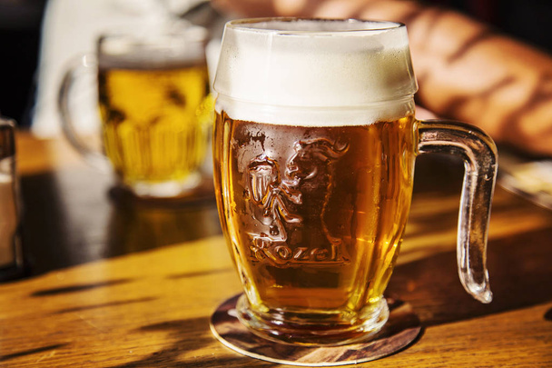 Prague, Czech Republic, September 27, 2018: Glass of unfiltered Czech beer Kozel - Foto, Imagen