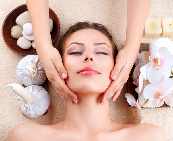 Spa Massage. Young Woman Getting Facial Massage - Valokuva, kuva